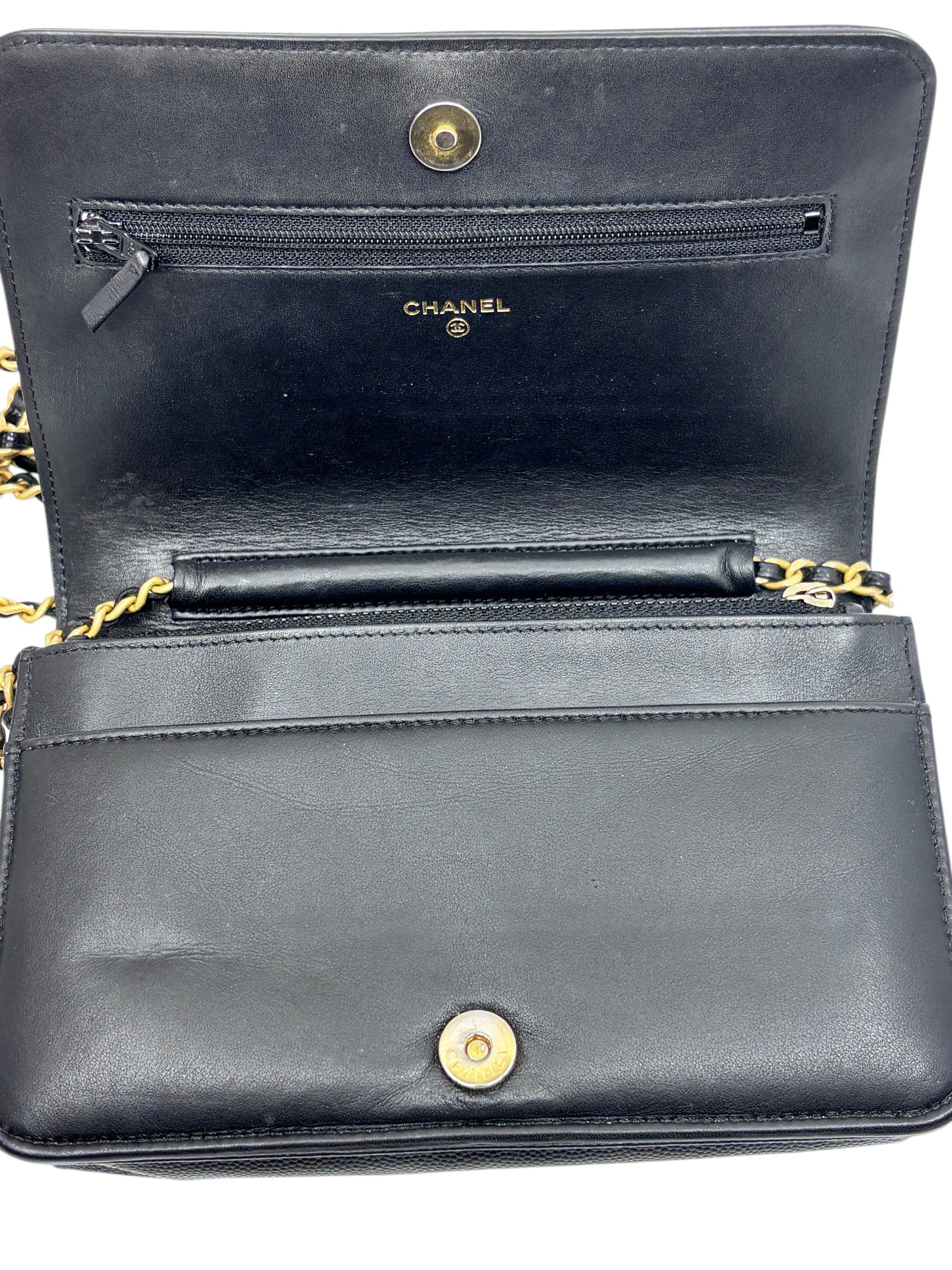 Interior of Posh Purse Co black Chanel Boy Wallet on Chain featuring gold hardware and zippered pocket