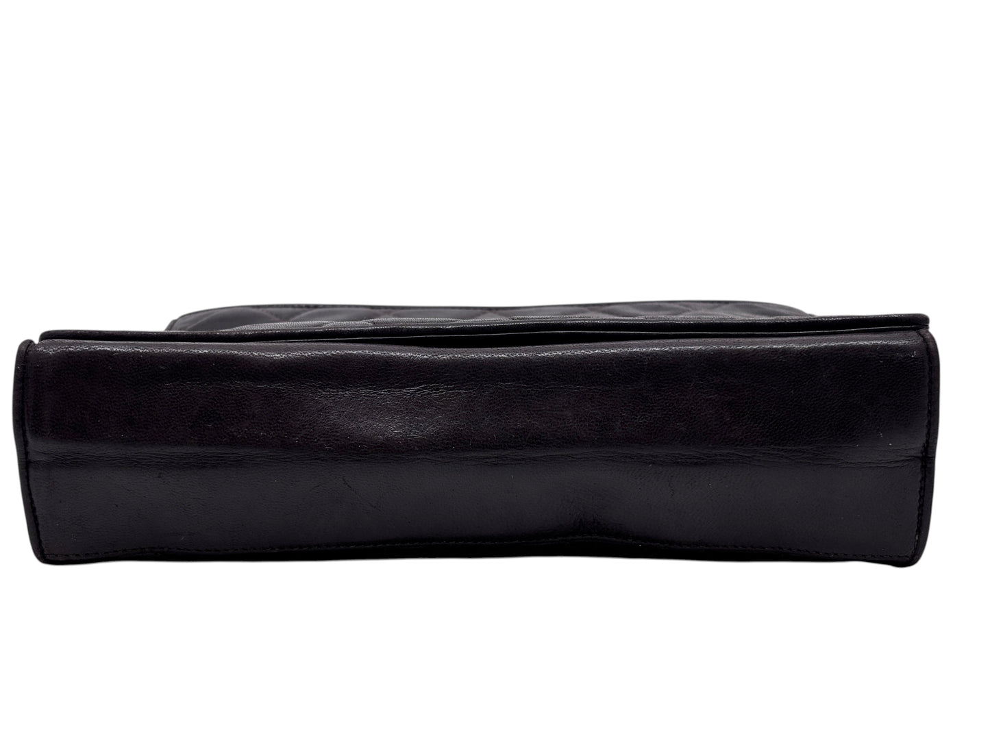 Posh Purse Co brown Chanel quilted Timeless flap crossbody bag viewed from the bottom edge showing leather texture