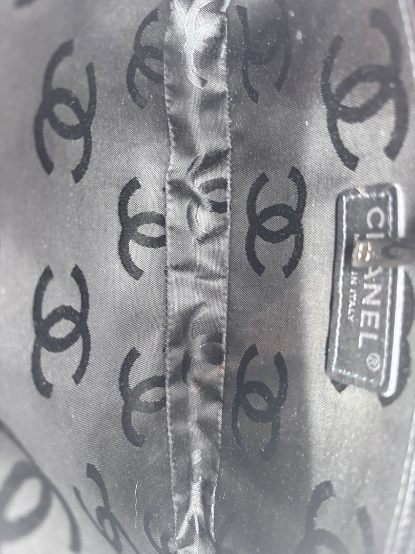 Posh Purse Co interior lining of a Chanel Cambon Ligne bag featuring a black fabric with repeating CC logo pattern