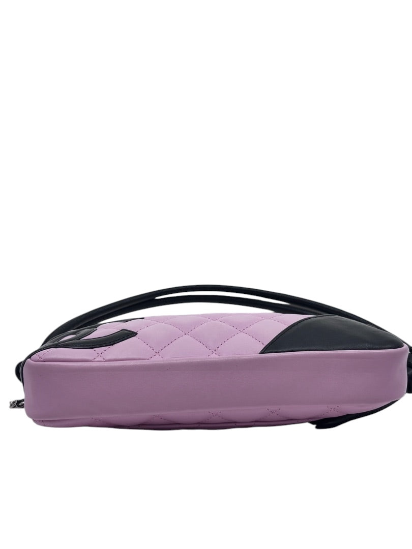 Posh Purse Co vintage Chanel Cambon Ligne bag in quilted pink leather with black trim and side view profile