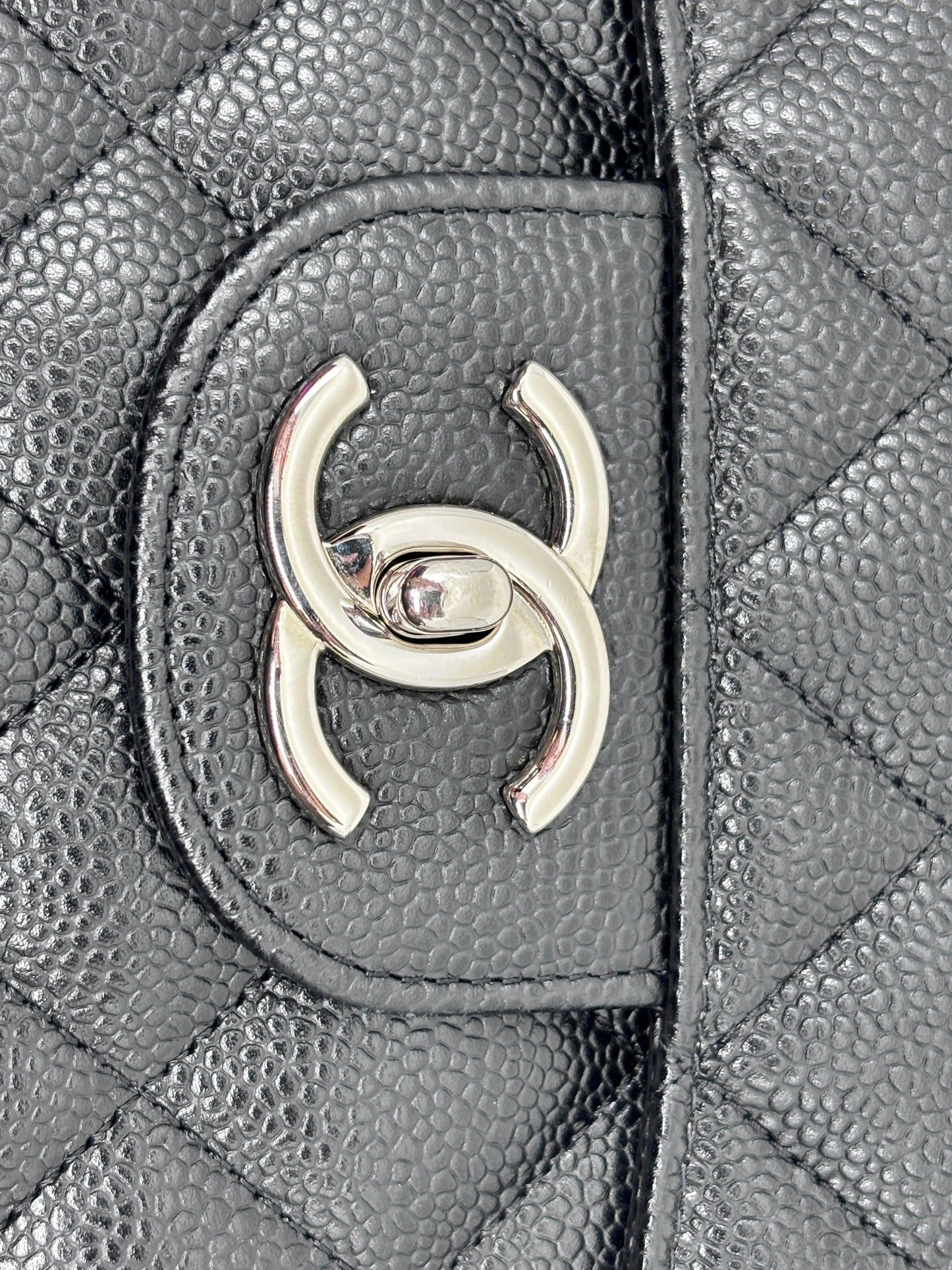 Posh Purse Co black quilted caviar leather Chanel Classic Jumbo Flap bag with silver CC turn-lock hardware
