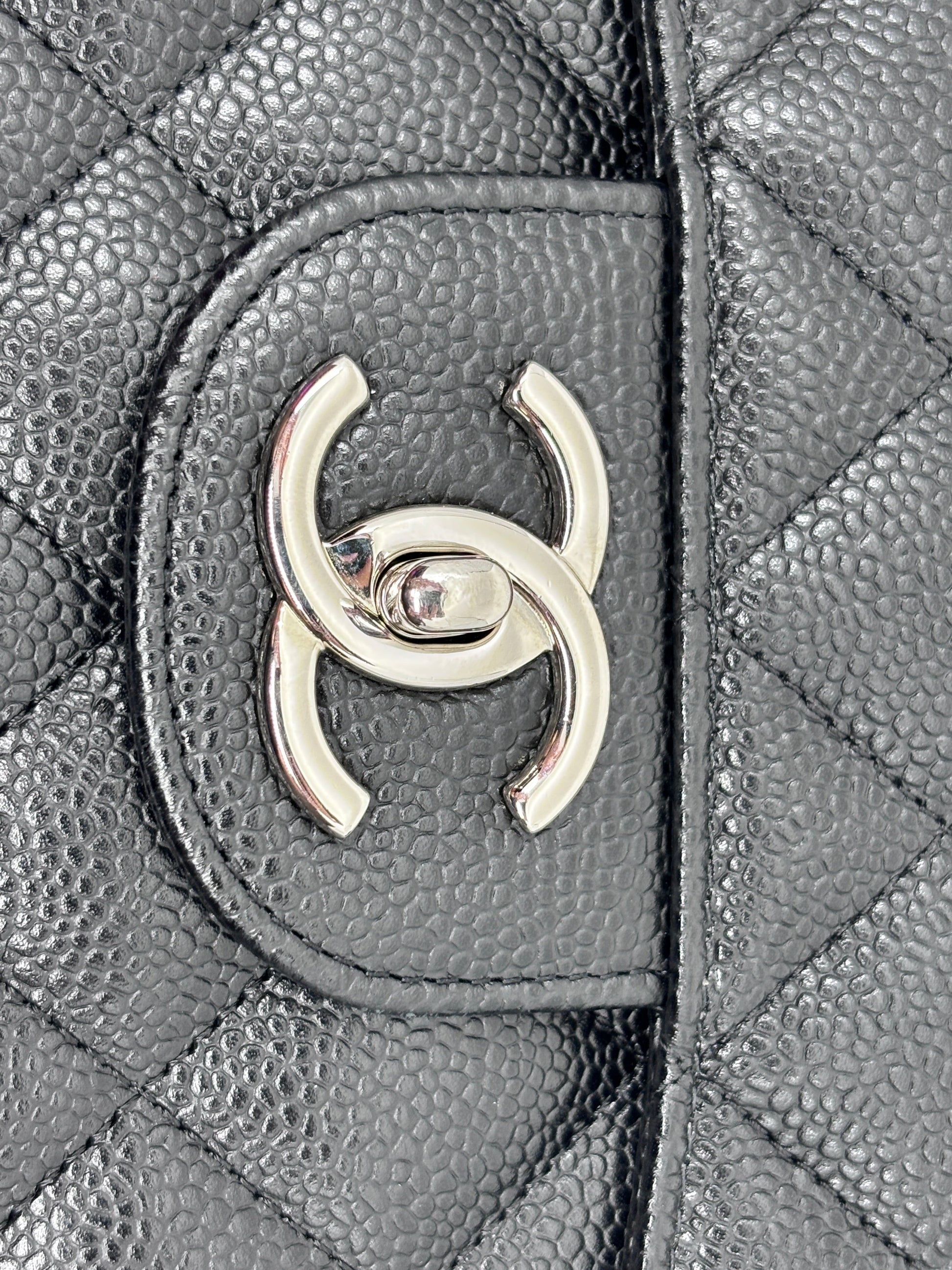 Posh Purse Co black quilted caviar leather Chanel Classic Jumbo Flap bag with silver CC turn-lock hardware