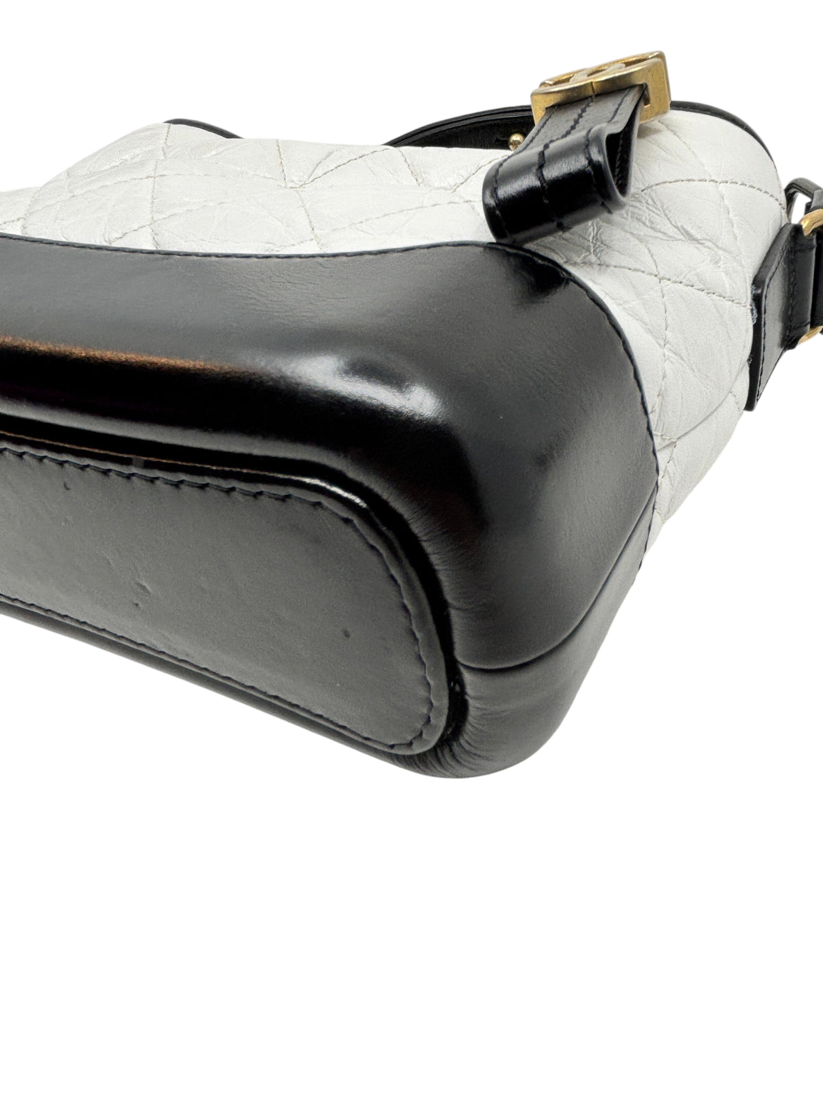Posh Purse Co preloved Chanel Gabrielle crossbody bag featuring a white quilted leather body and black leather base.