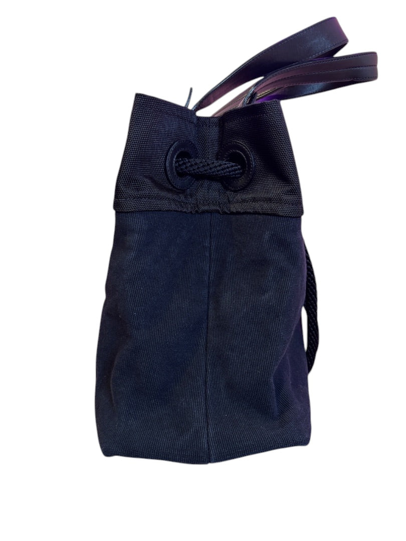 Posh Purse Co. black and blue canvas Chanel XXL beach tote with leather straps and drawstring closure.