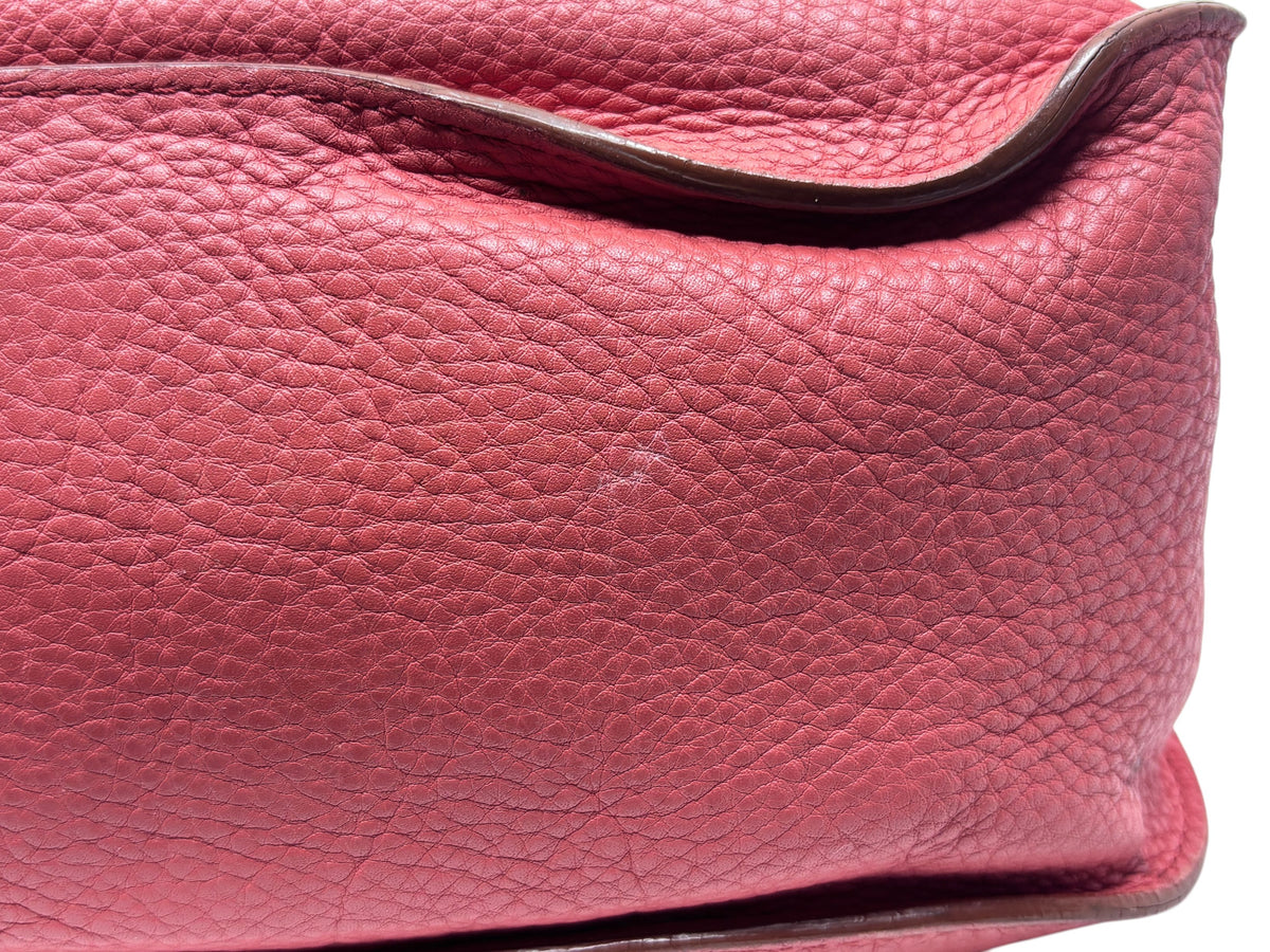 Close-up of Posh Purse Co. preowned Chloé Marcie medium satchel in coral grained leather with signature stitching.