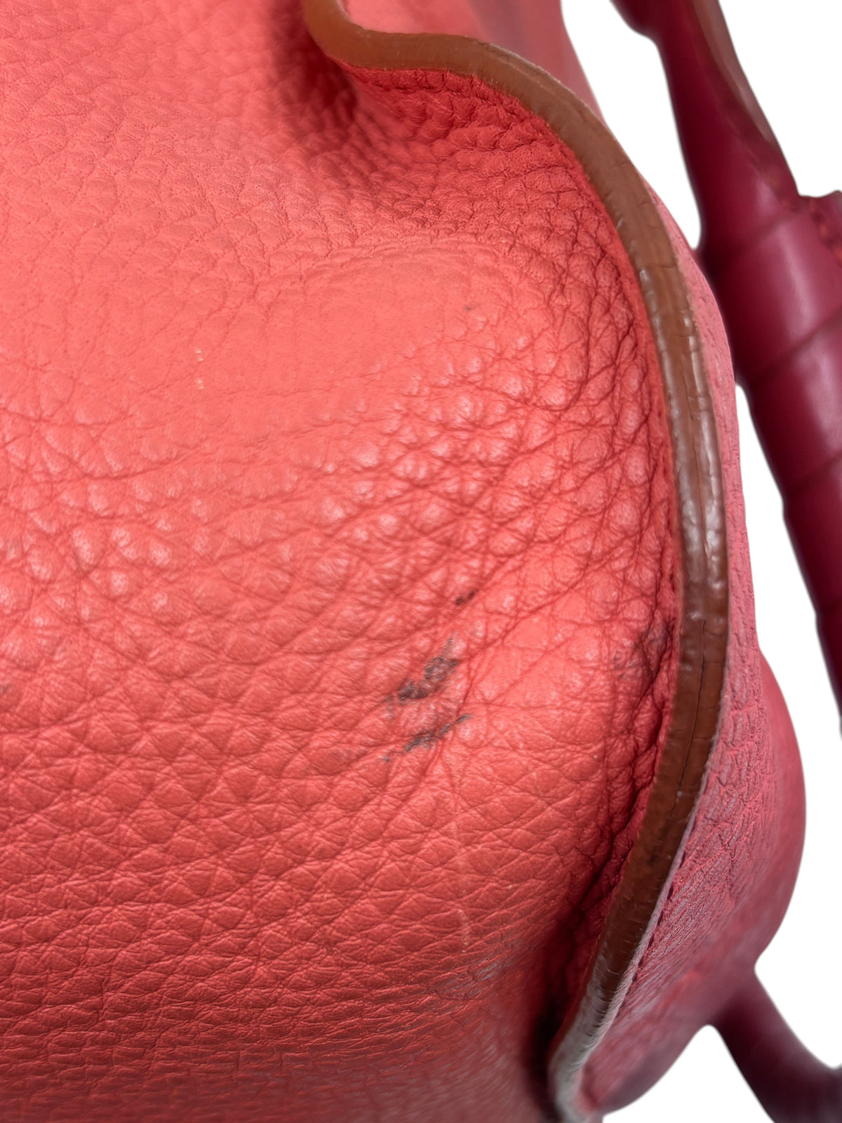 Close-up of Posh Purse Co. preowned coral Chloé Marcie satchel showing textured leather and minor exterior marks