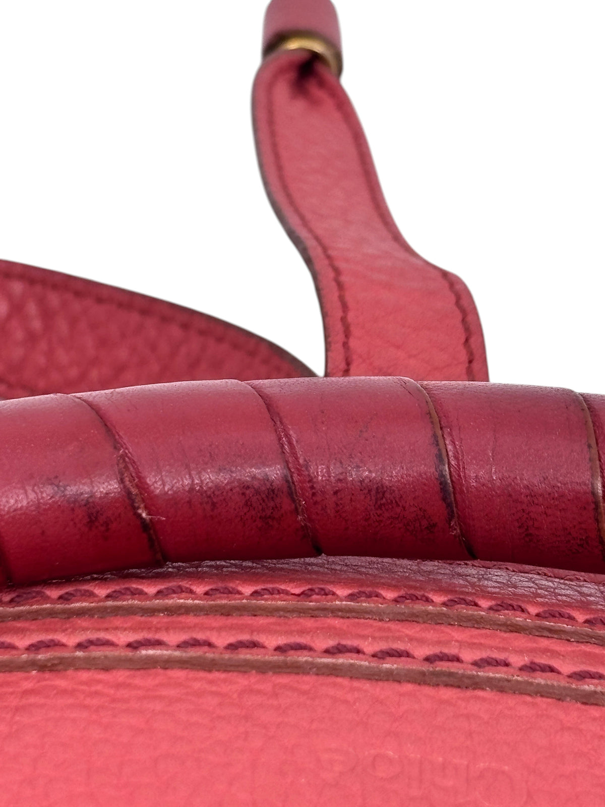 Posh Purse Co. preowned Chloé Marcie medium satchel in coral leather showing close-up of handle and curved stitching