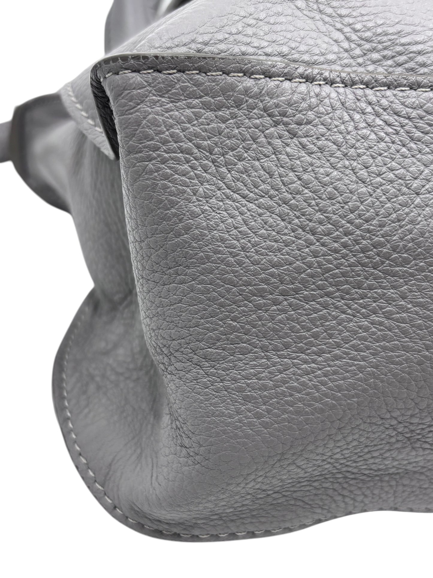 Close-up of gray pebbled leather texture and stitching on a Posh Purse Co Chloé Marcie medium satchel bag