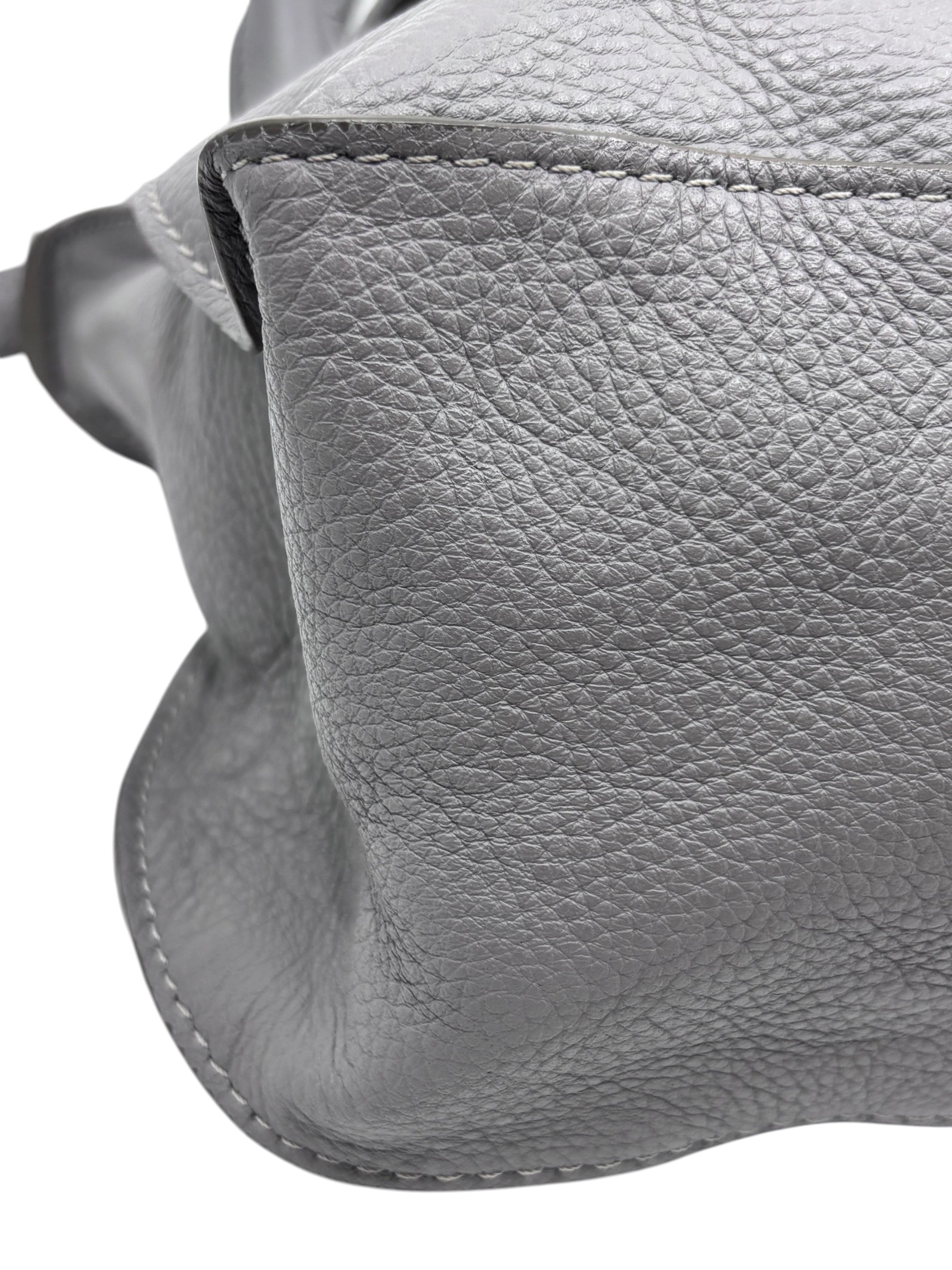 Close-up of gray pebbled leather texture and stitching on a Posh Purse Co Chloé Marcie medium satchel bag