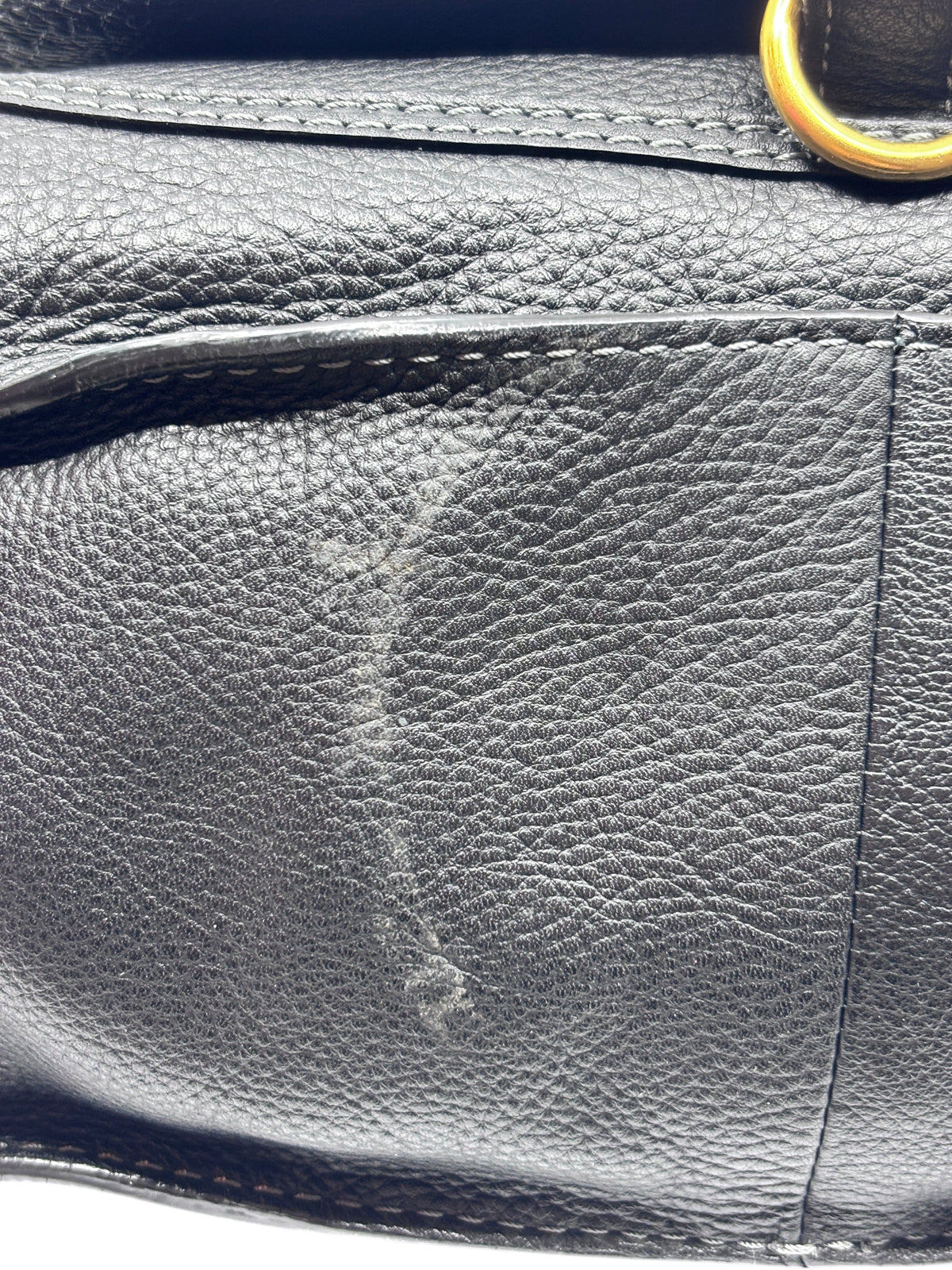 Close-up of the black leather texture and wear on a Posh Purse Co. Chloé Marcie medium satchel bag