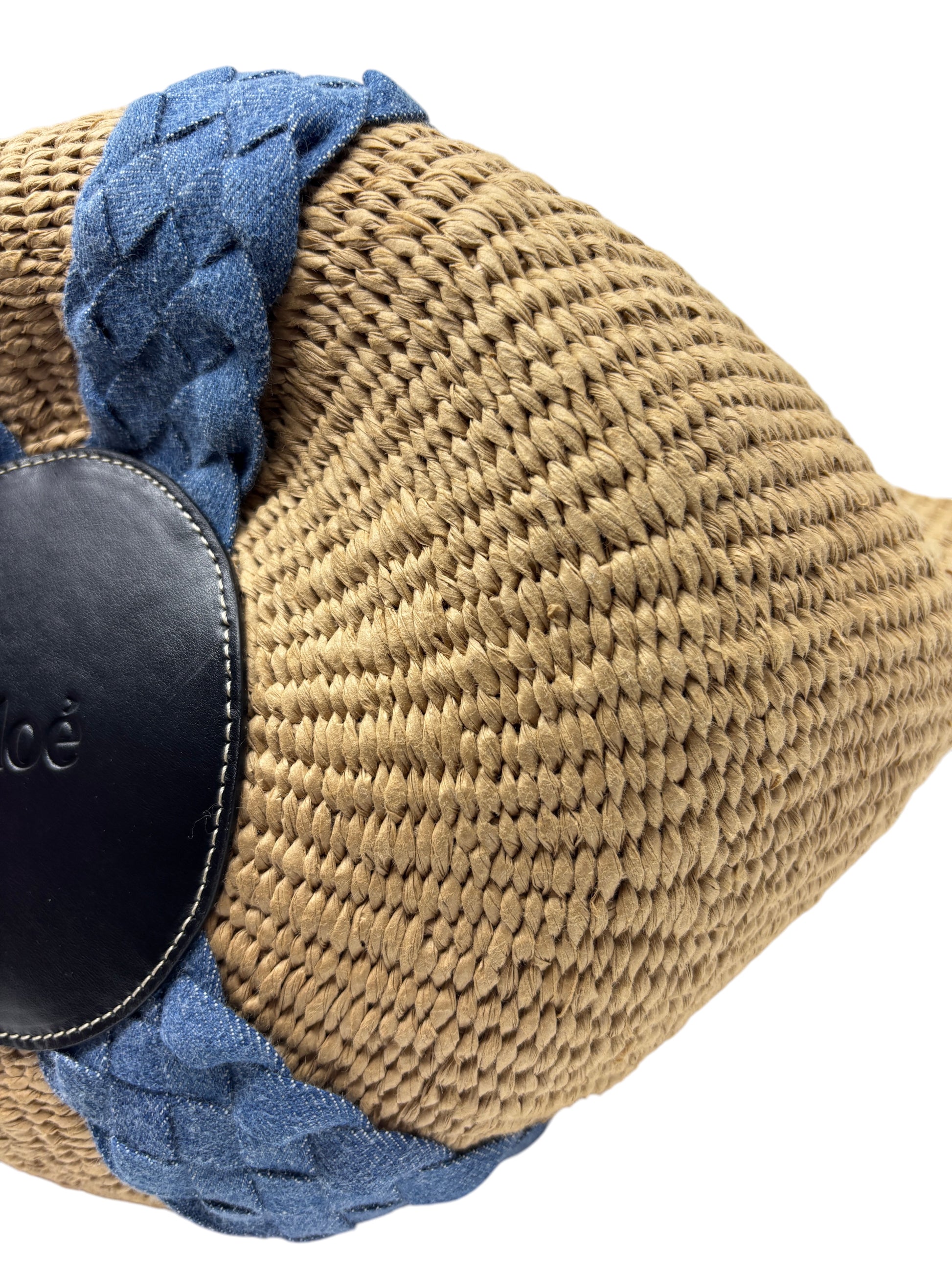 Posh Purse Co. Chloé Woody basket bag featuring natural woven straw texture with blue denim braided trim and logo patch