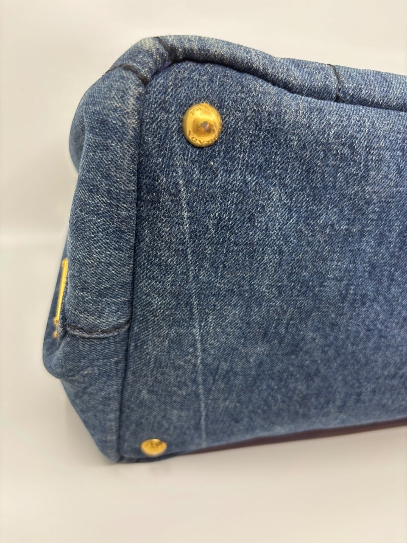 Posh Purse Co Avio blue denim tote bag with gold hardware accents.