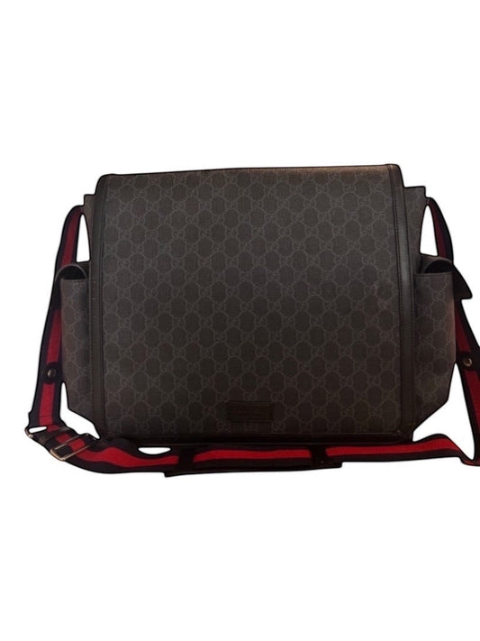 Posh Purse Co designer messenger bag in signature GG canvas with red and blue striped adjustable strap. Leather trim and exterior pockets.