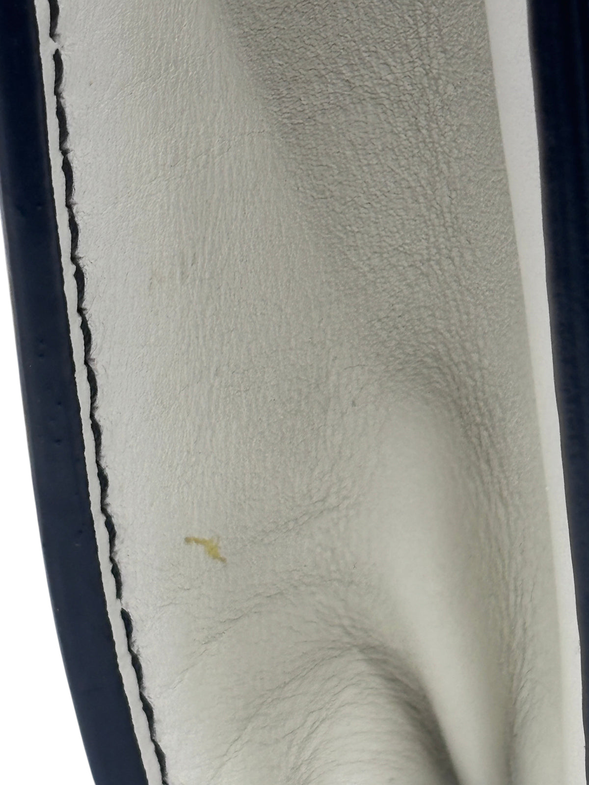 Close-up of the interior leather lining of a Posh Purse Co ivory Dior J'Adior bag showing minor staining