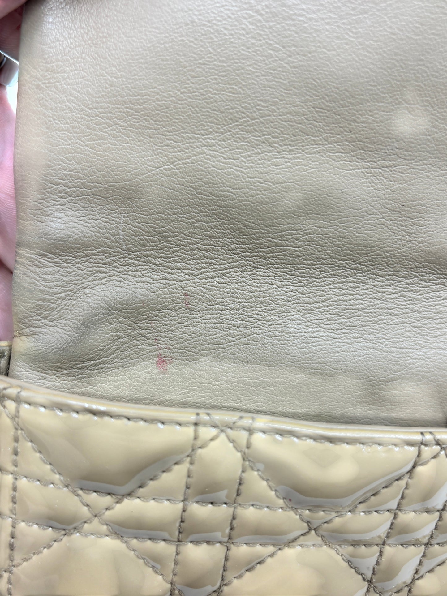 Posh Purse Co Dior Miss Dior Promenade bag interior showing beige leather lining with minor surface wear and marks.