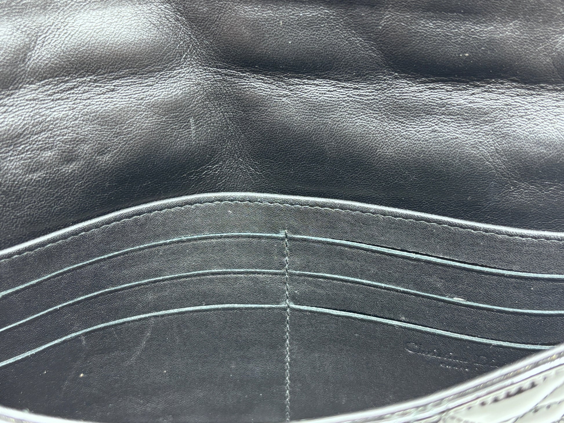Interior of Posh Purse Co black patent leather Dior Cannage bag showing card slots and leather lining