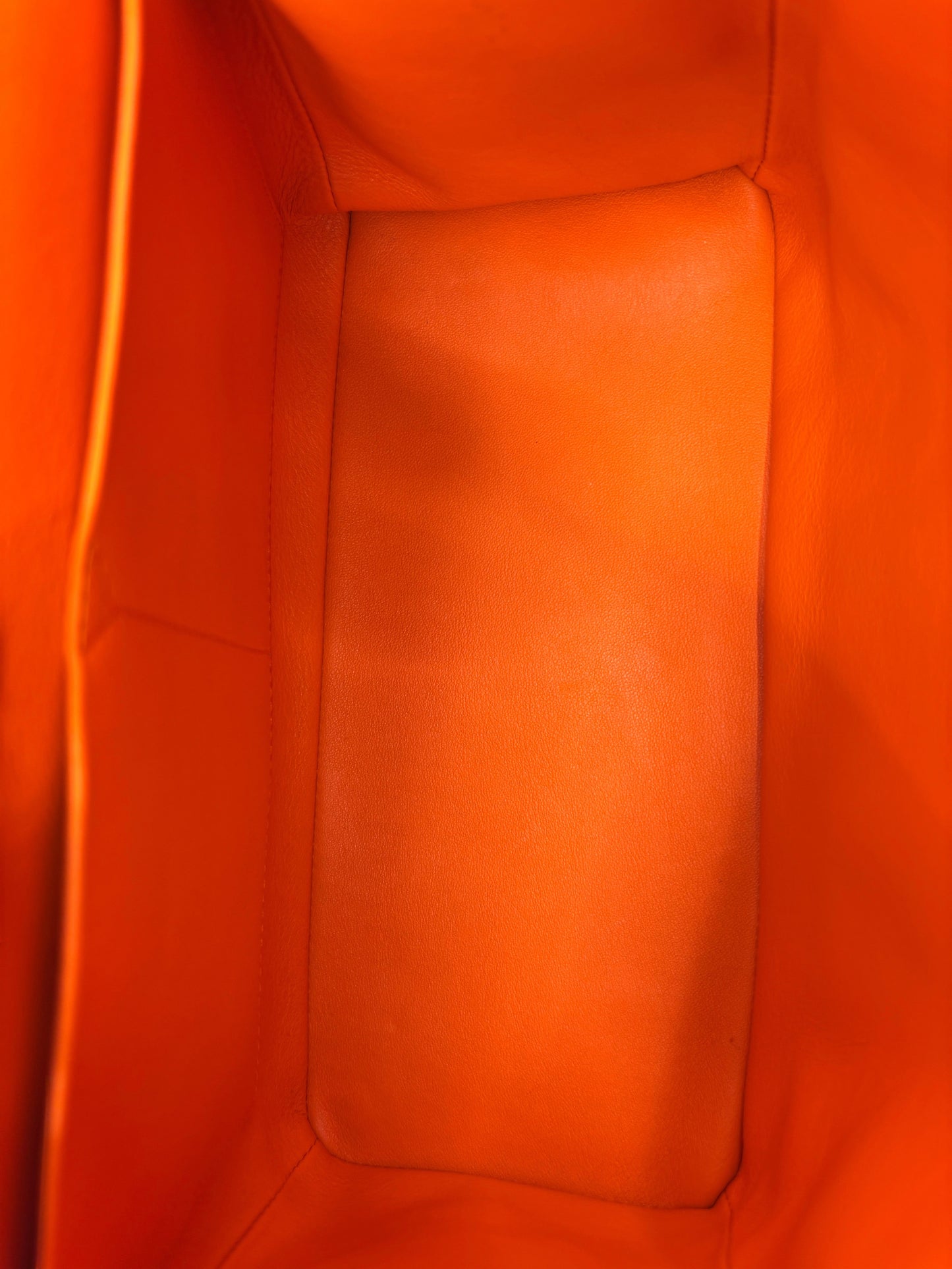 Posh Purse Co interior view of the orange leather lining inside a Christian Dior Be Dior handbag