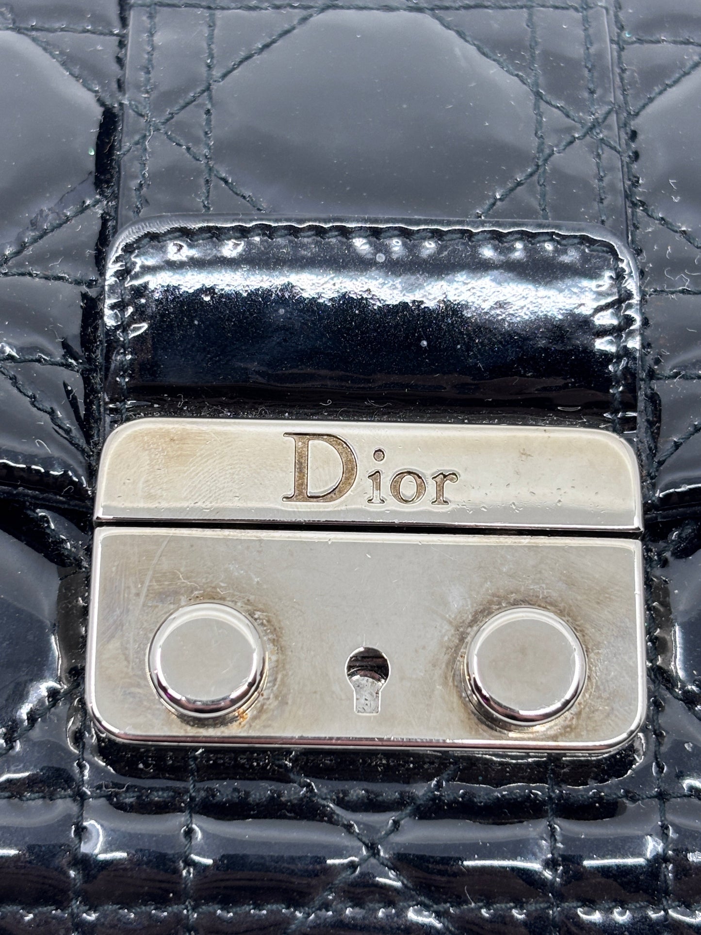 Posh Purse Co black patent leather Dior Cannage bag featuring signature quilted pattern and polished metal logo clasp