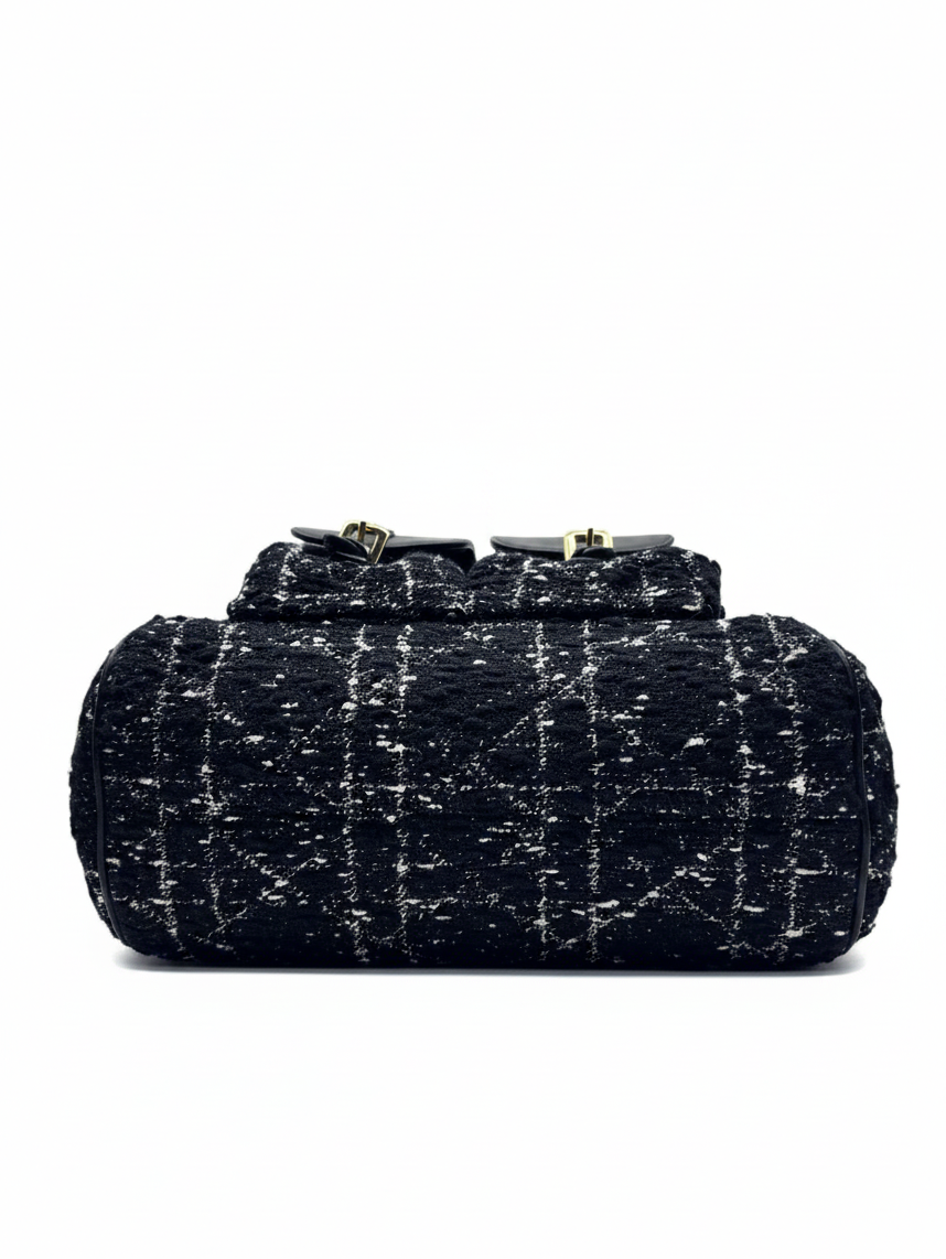 Posh Purse Co Dior Caro backpack in black tweed with signature Cannage pattern, viewed from the top.