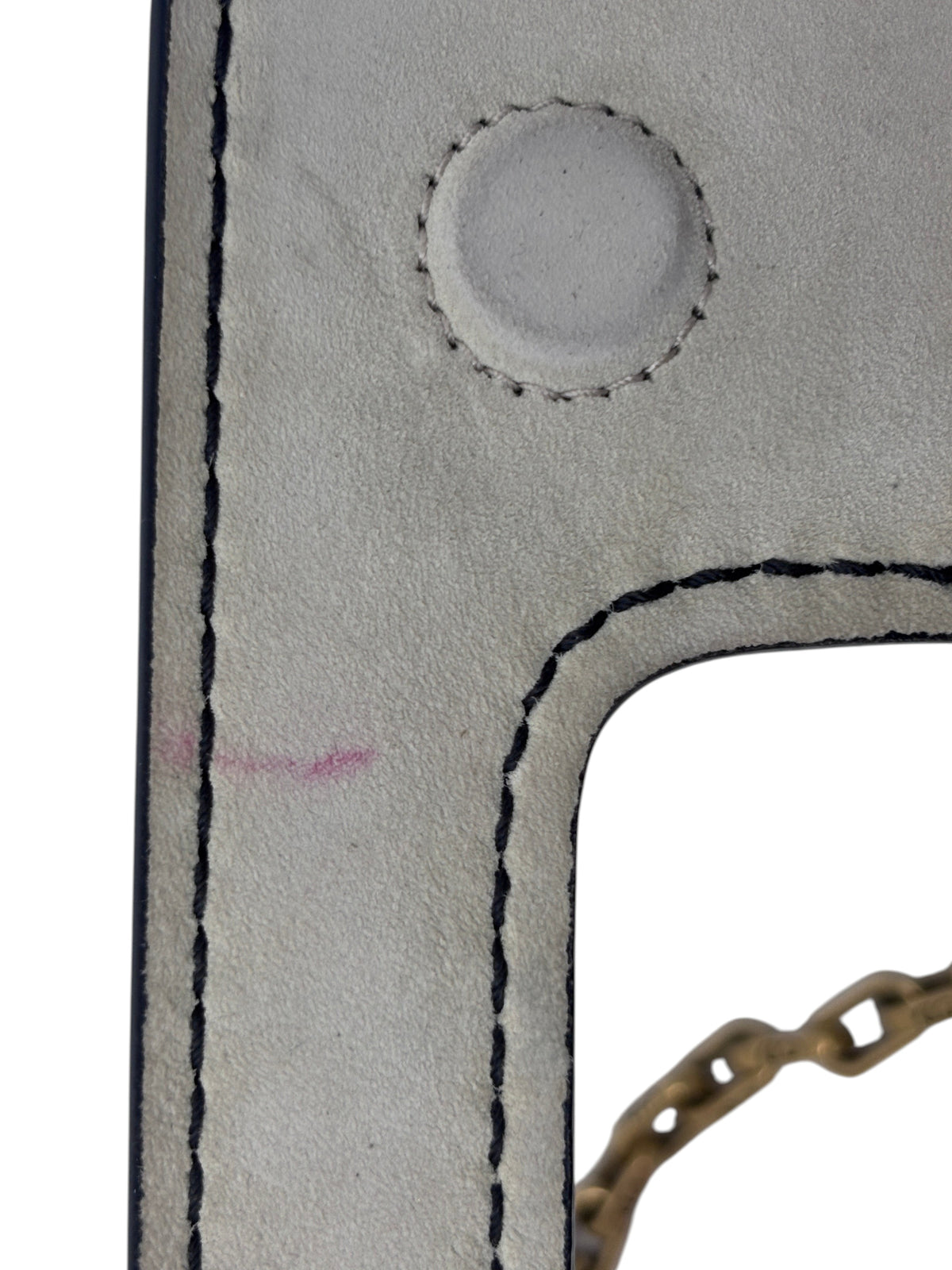 Close-up of Posh Purse Co ivory Dior J'adior bag showing suede texture, black stitching, and minor pink mark.