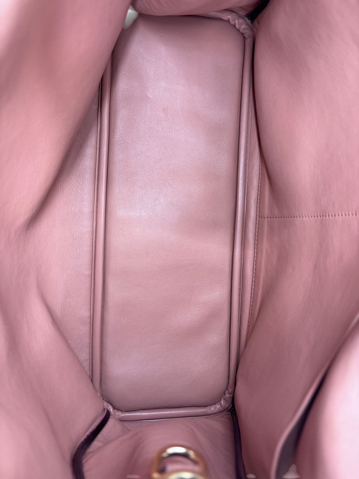 Interior view of a Posh Purse Co preloved Dior Diorissimo leather tote bag featuring a spacious pink leather lining.
