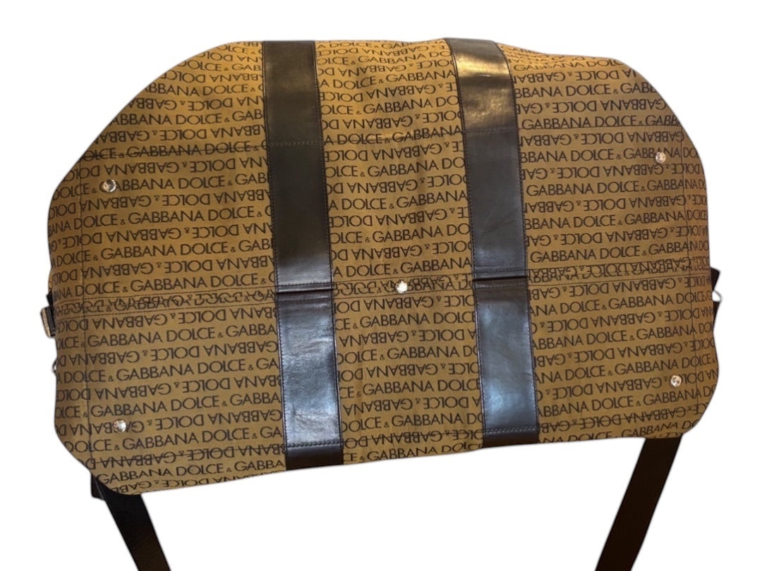 Posh Purse Co Dolce & Gabbana brown canvas weekend duffel bag with all-over logo print and dark brown leather trim.