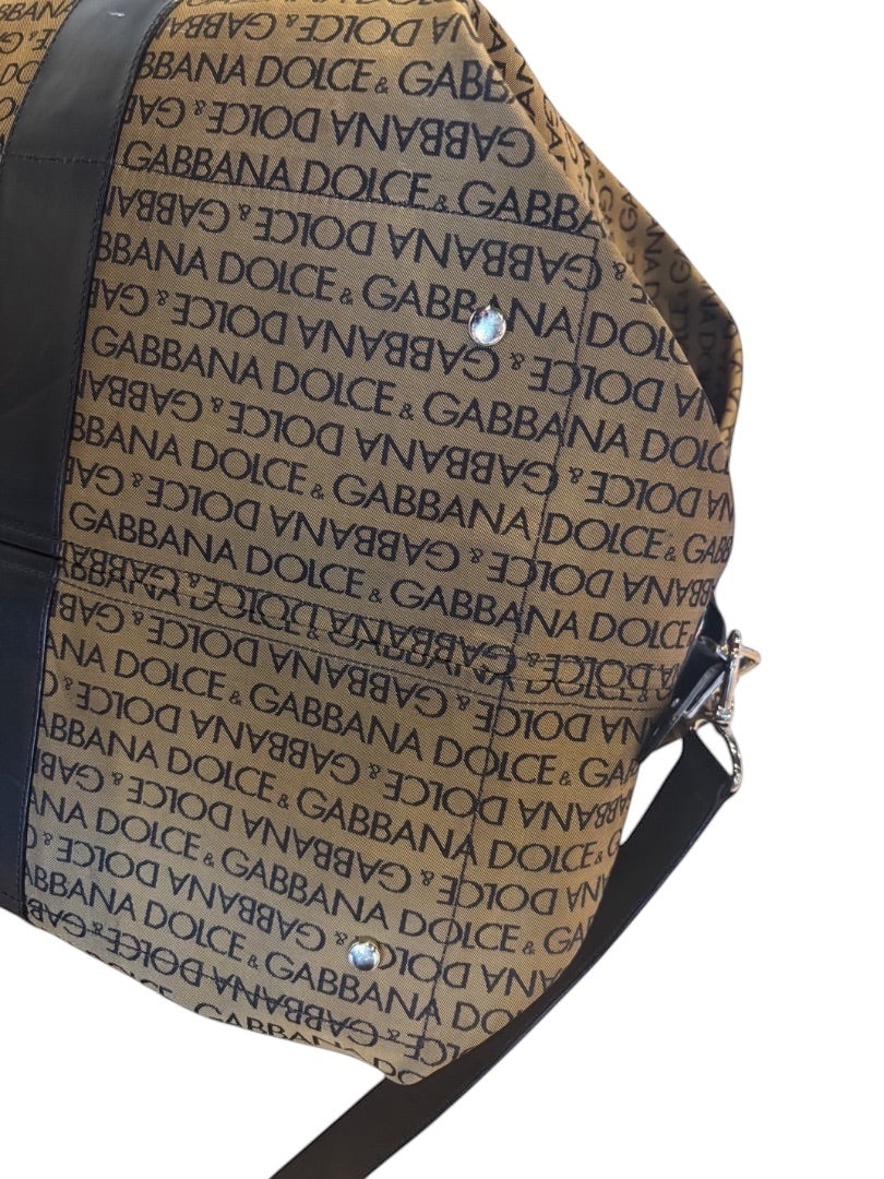 Posh Purse Co Dolce & Gabbana tan canvas weekend duffel bag with black leather trim and all-over logo print.