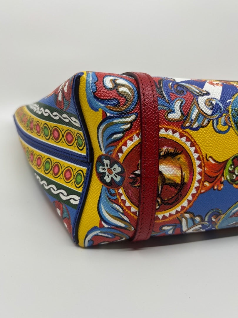 Posh Purse Co. Dolce & Gabbana Dauphine Escape tote bag with colorful print and red leather trim.