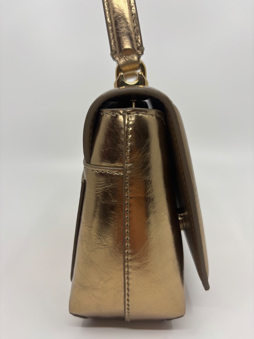 Posh Purse Co. Dolce & Gabbana small gold metallic leather top handle bag with structured silhouette.