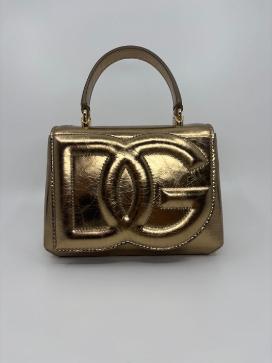 Posh Purse Co. Dolce & Gabbana small gold top handle bag with embossed DG logo. Structured metallic leather.