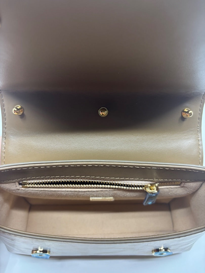 Posh Purse Co. Dolce & Gabbana small gold top handle bag interior with zipper pocket and gold hardware.