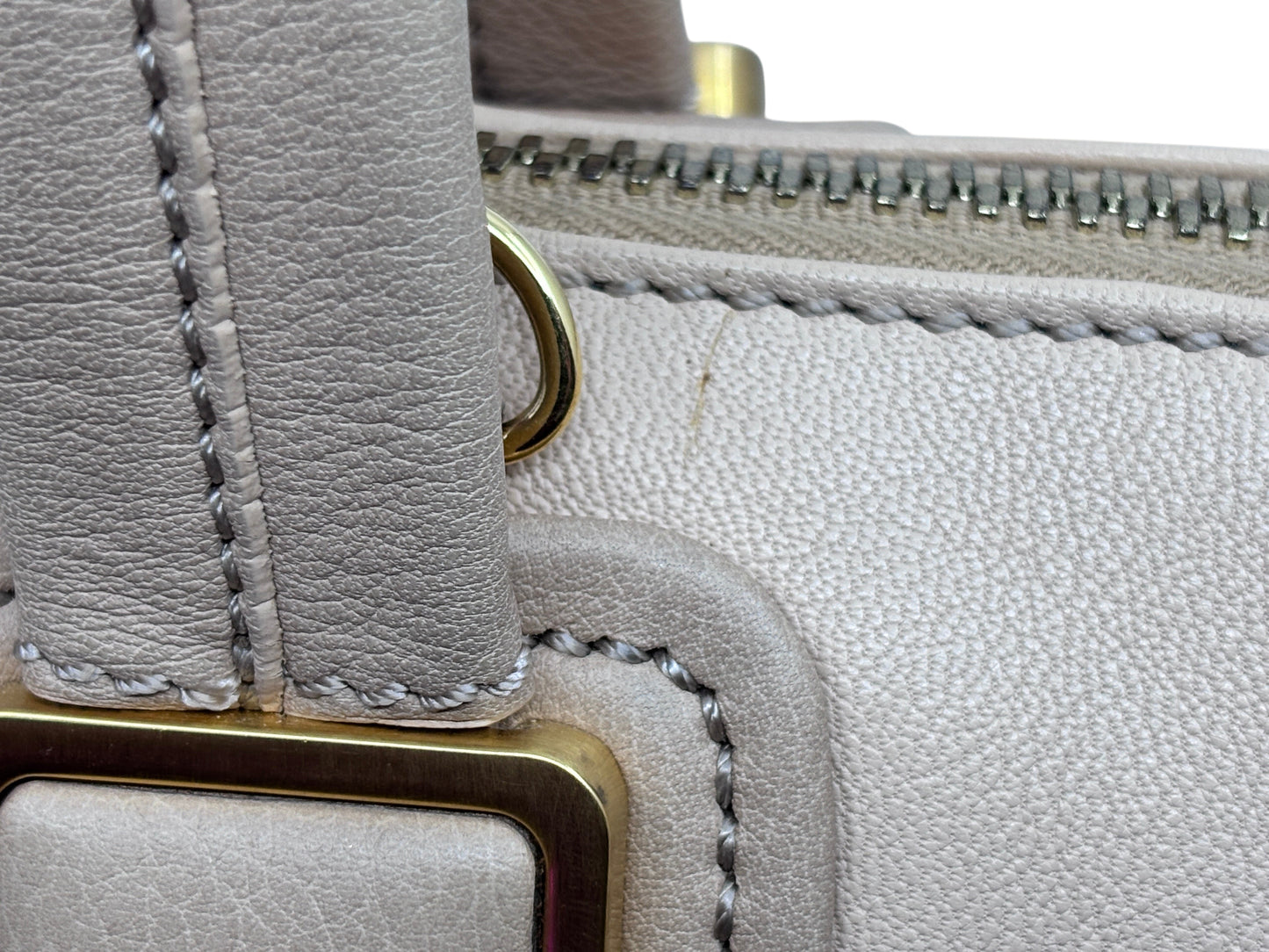Close-up of Posh Purse Co preloved Fendi Chameleon satchel showing tan leather texture, stitching, and gold hardware.