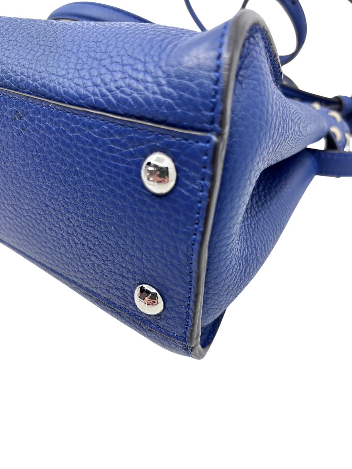 Posh Purse Co. blue Fendi Selleria Peekaboo Mini bag showing textured leather base, silver protective feet, and stitching.