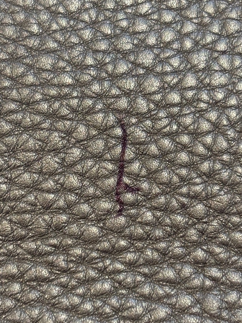 Posh Purse Co. Fendi Silver Baguette metallic leather with purple mark on textured surface.