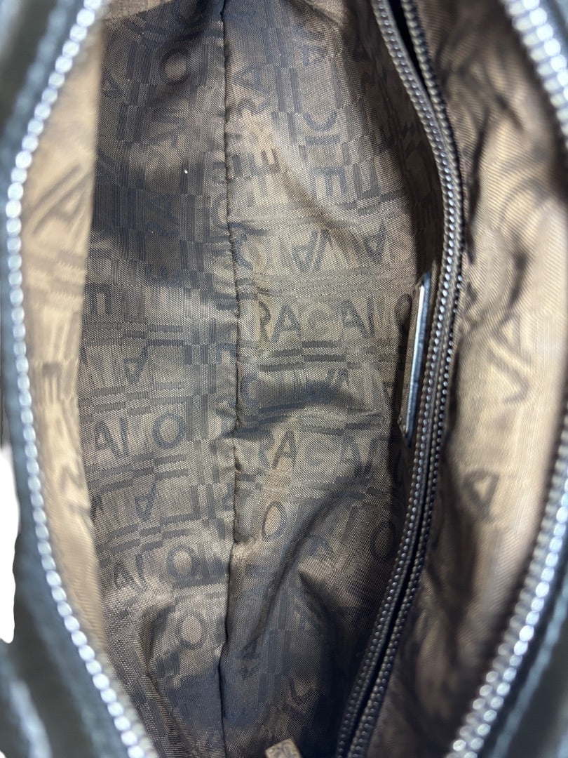 Interior of a Posh Purse Co. Ferragamo shoulder bag featuring brown fabric lining with signature logo pattern