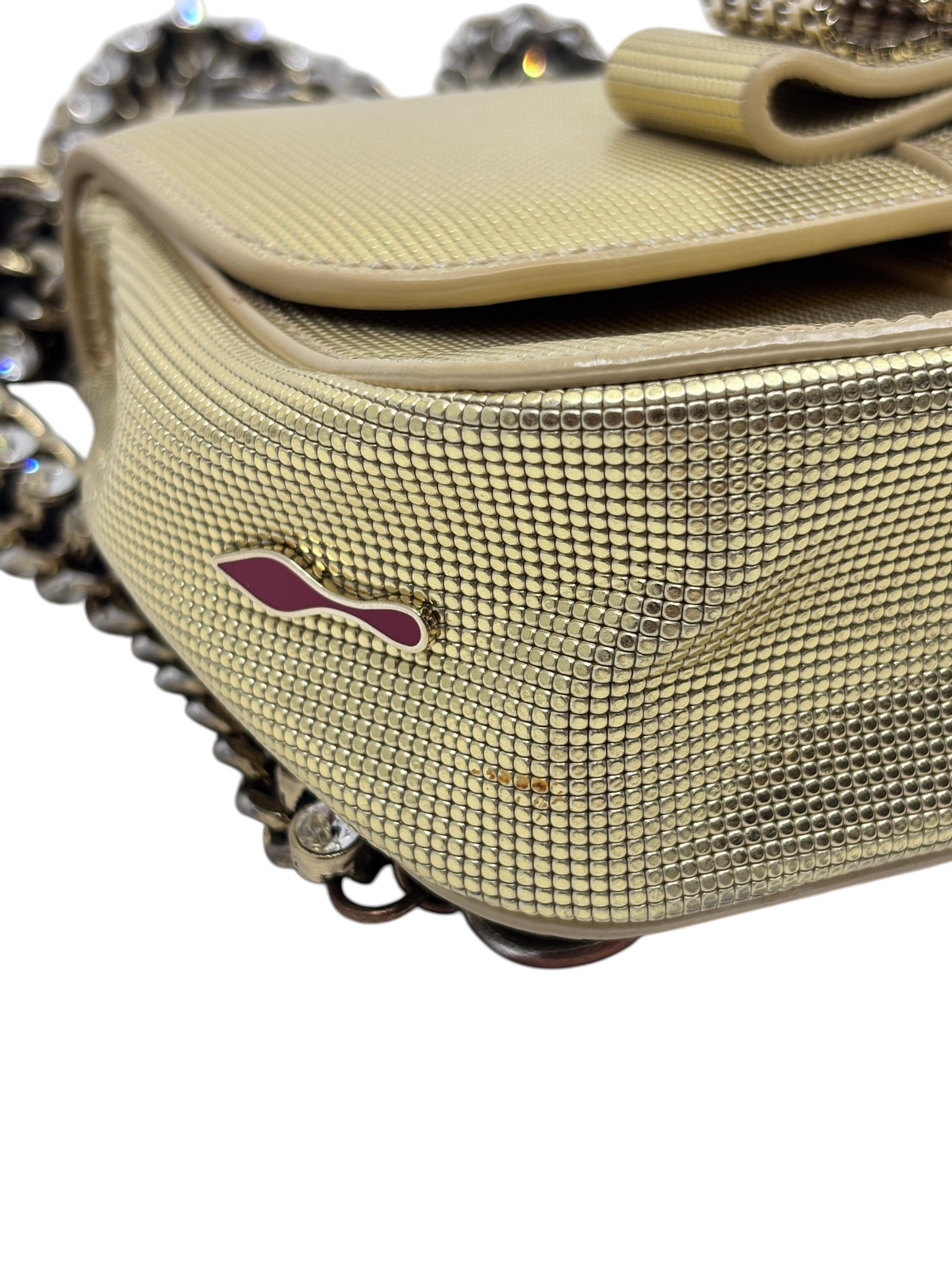 Posh Purse Co gold Christian Louboutin Sweet Charity backpack with textured metallic finish and side logo detail