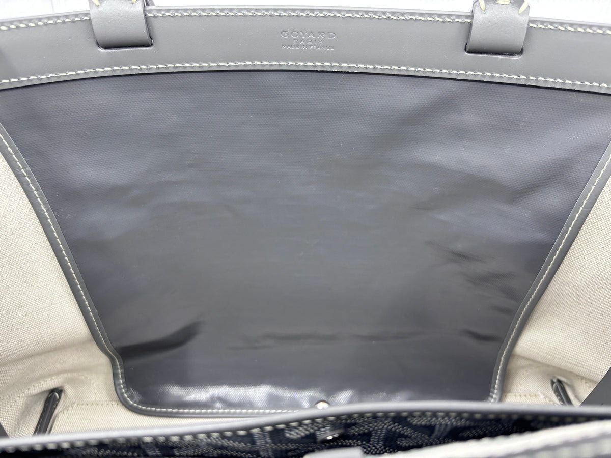 Interior view of a gray Goyard Bellechasse tote bag from Posh Purse Co, showing the brand stamp and leather trim.