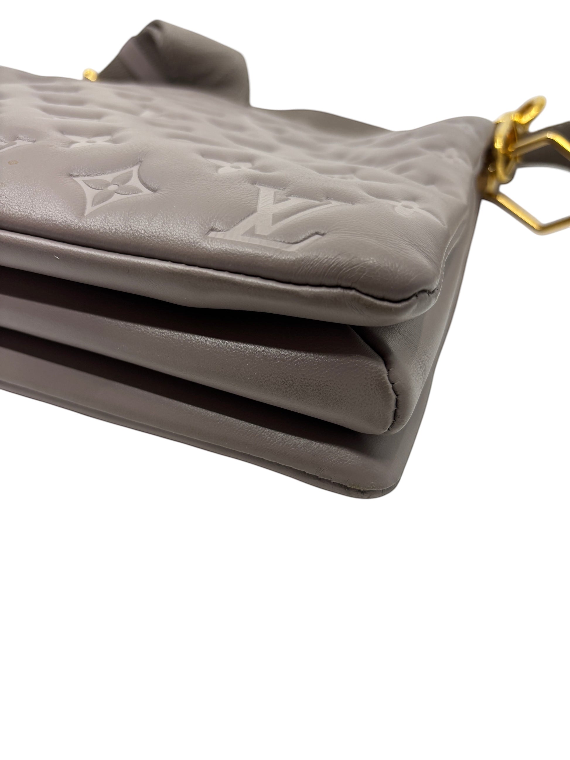 Posh Purse Co grey Louis Vuitton Coussin Large handbag in Monogram-embossed leather with gold hardware detail.