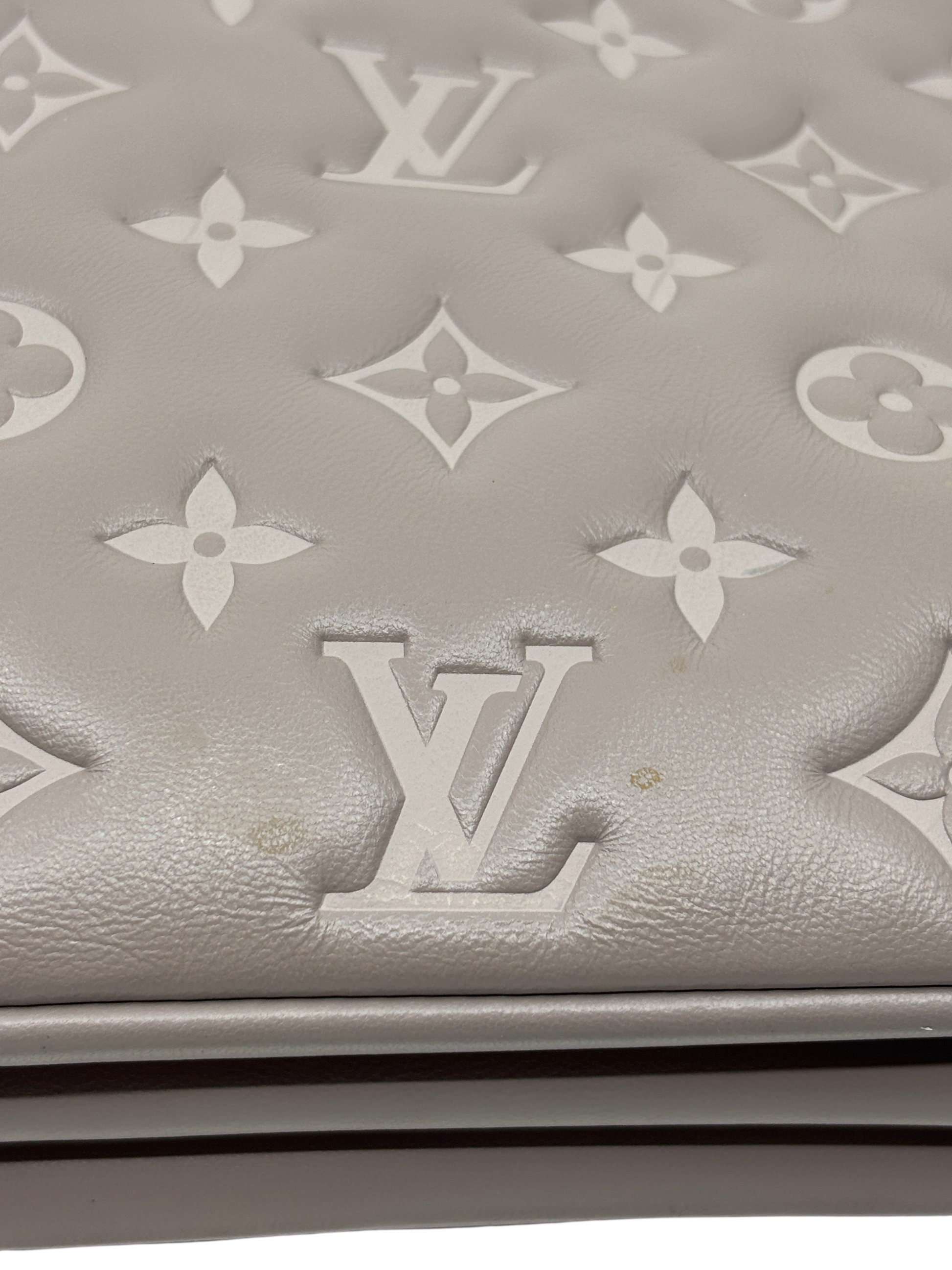 Posh Purse Co grey Louis Vuitton Coussin large handbag featuring plush Monogram-embossed leather detail.