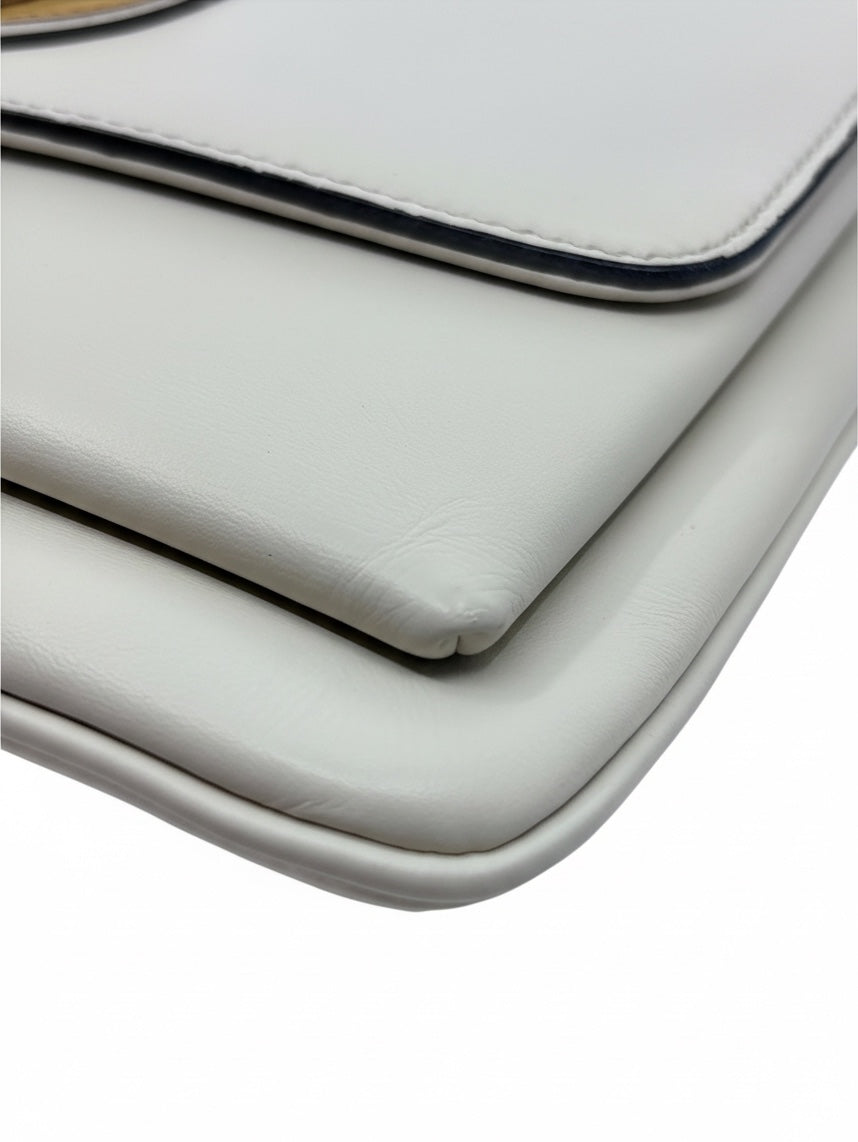 Close-up of the smooth ivory leather corner and flap edge of a Posh Purse Co. Gucci Arli handbag.