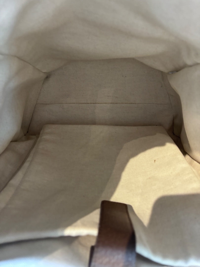 Interior view of the Posh Purse Co Gucci GG Supreme Ophidia backpack featuring a clean beige fabric lining