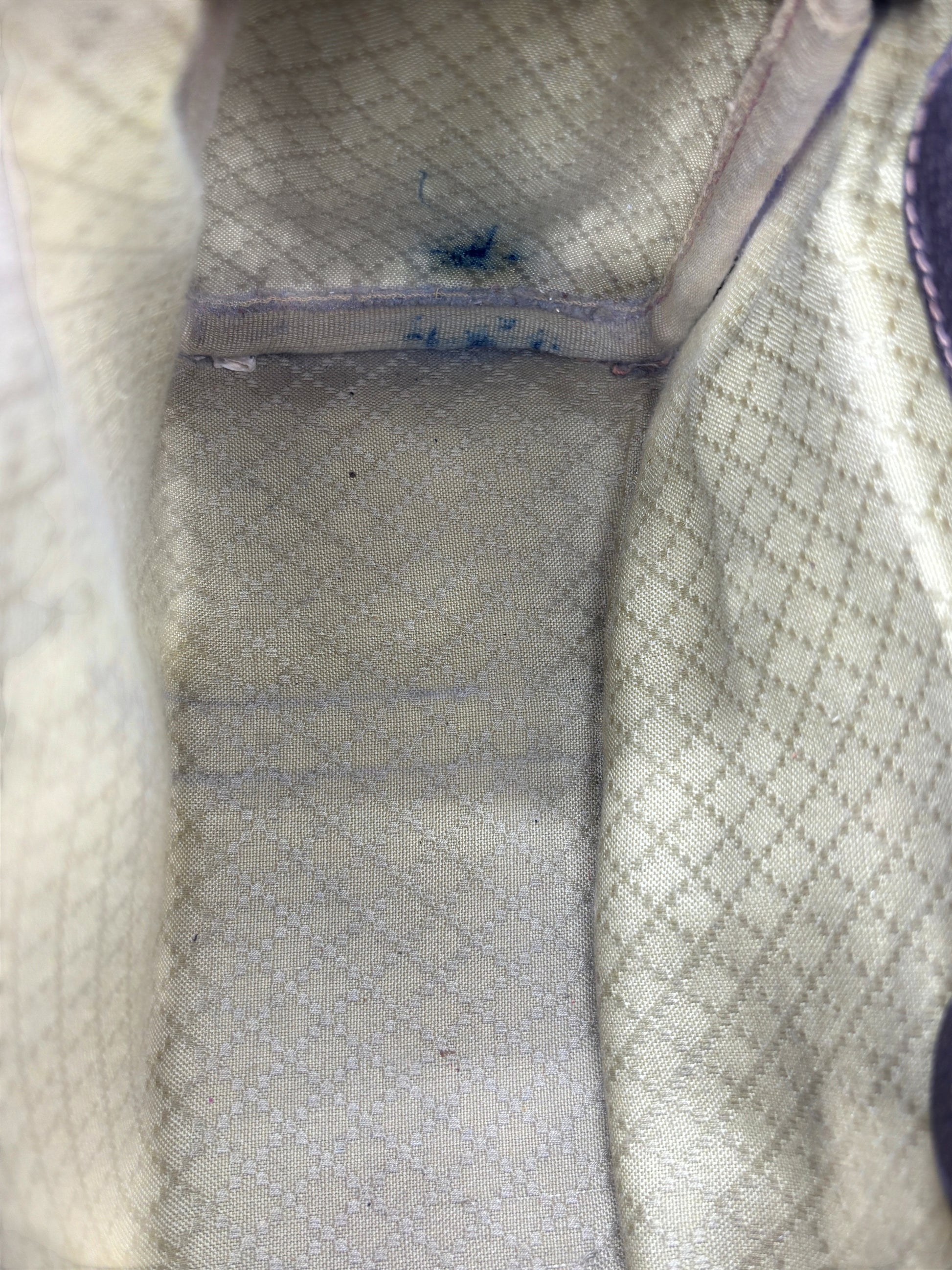 Interior of a vintage Gucci Boston bag from Posh Purse Co featuring a beige monogram fabric lining with visible wear