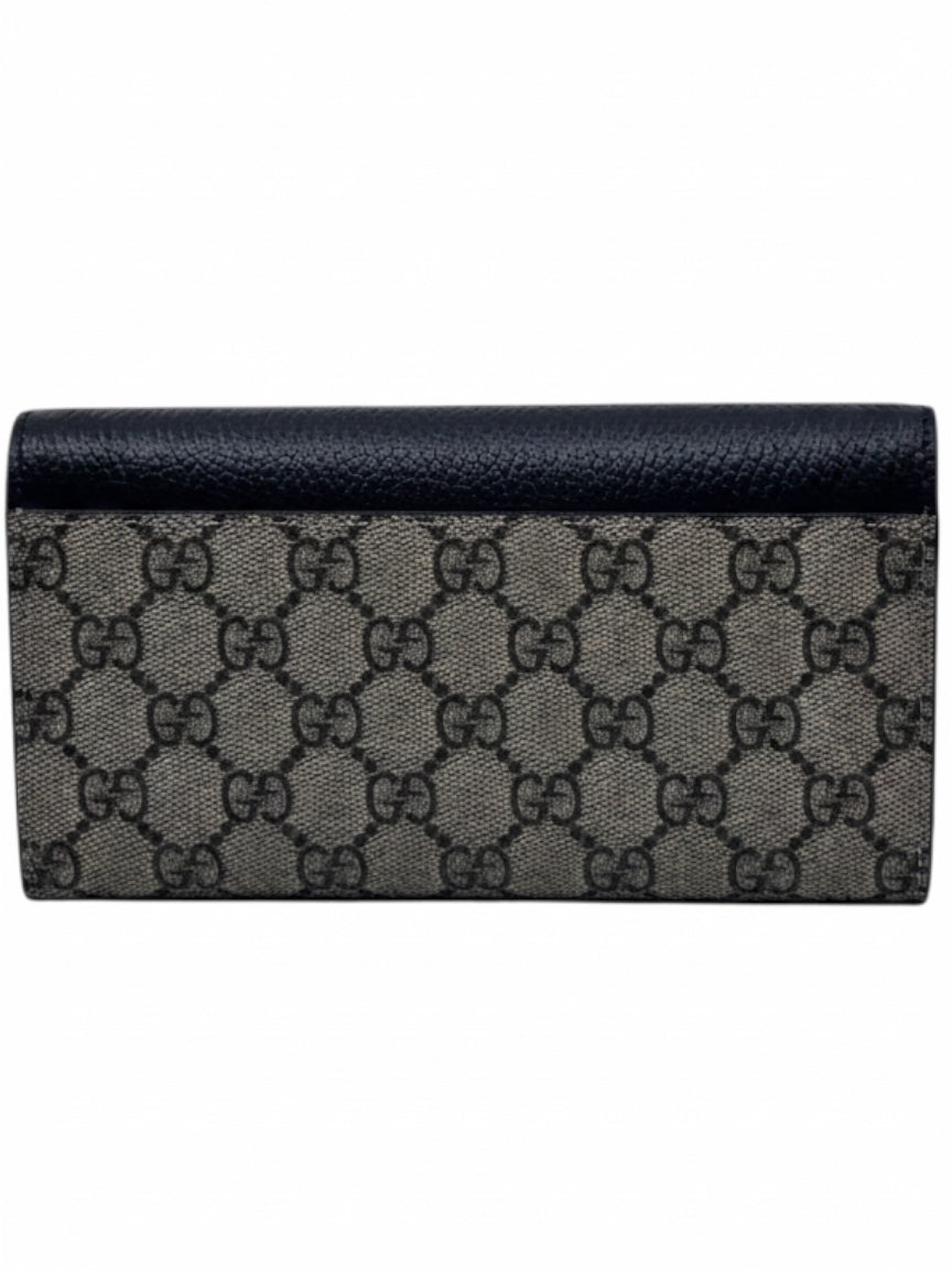 Posh Purse Co preloved Gucci bicolor continental wallet in black leather and signature GG monogram canvas