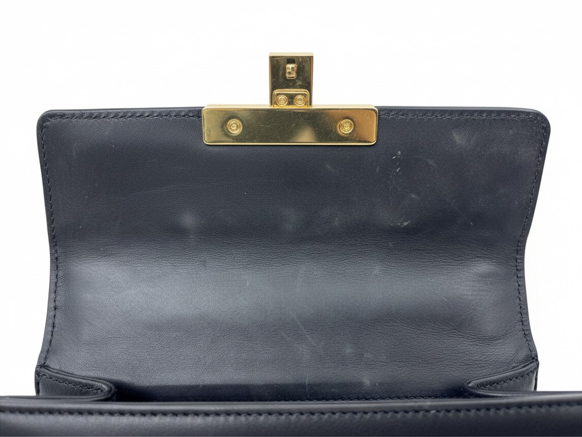 Posh Purse Co black leather Gucci shoulder bag interior with gold-tone metal clasp hardware