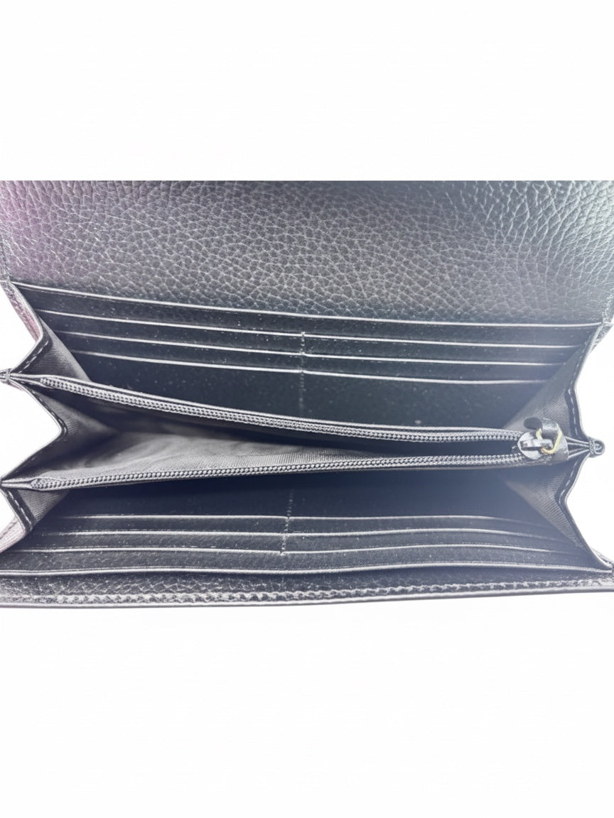 Interior view of a black Posh Purse Co Gucci continental wallet featuring multiple card slots and a zippered pocket.