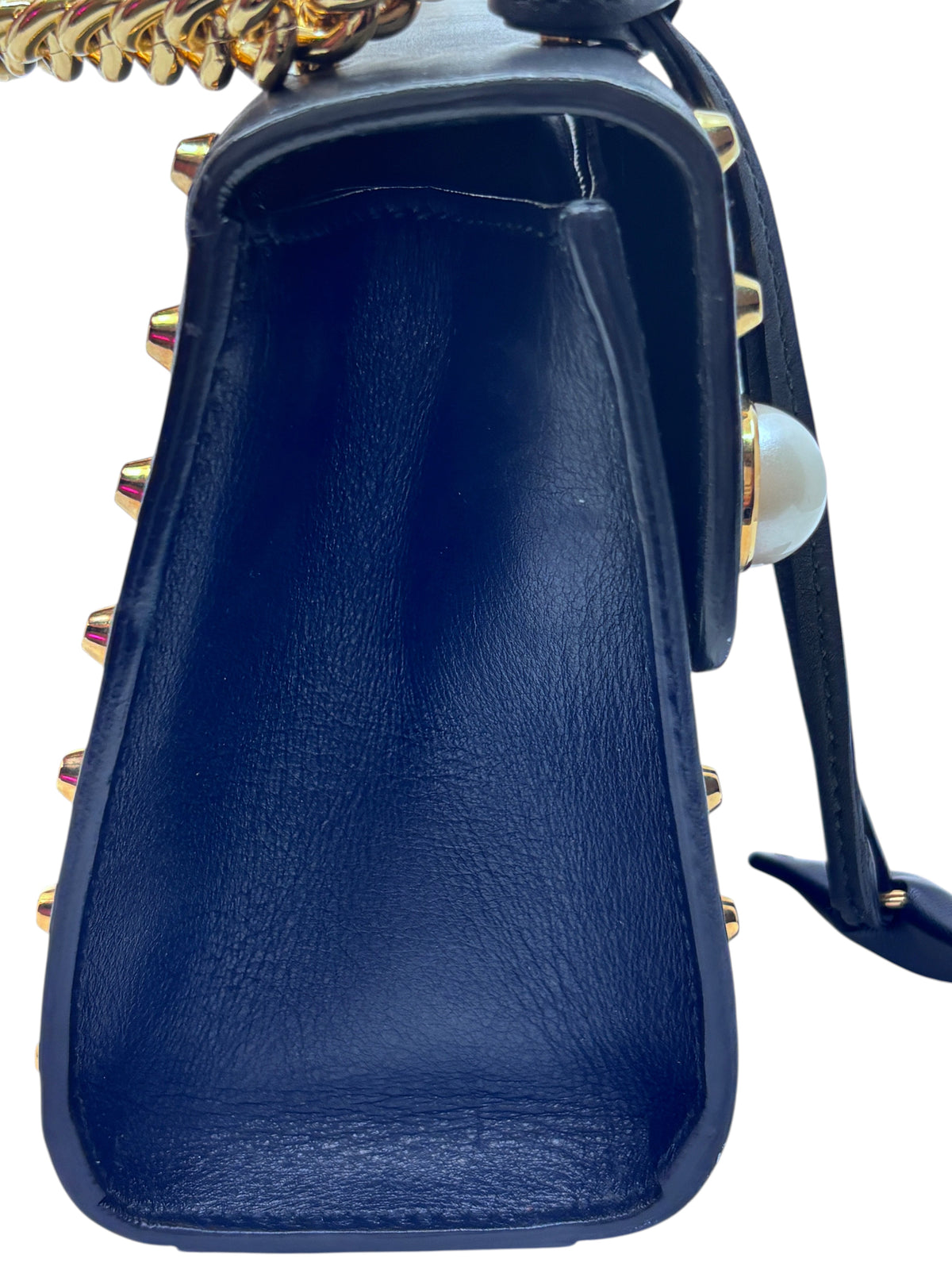 Posh Purse Co black Gucci shoulder bag side view featuring gold-tone hardware and pearl embellishments