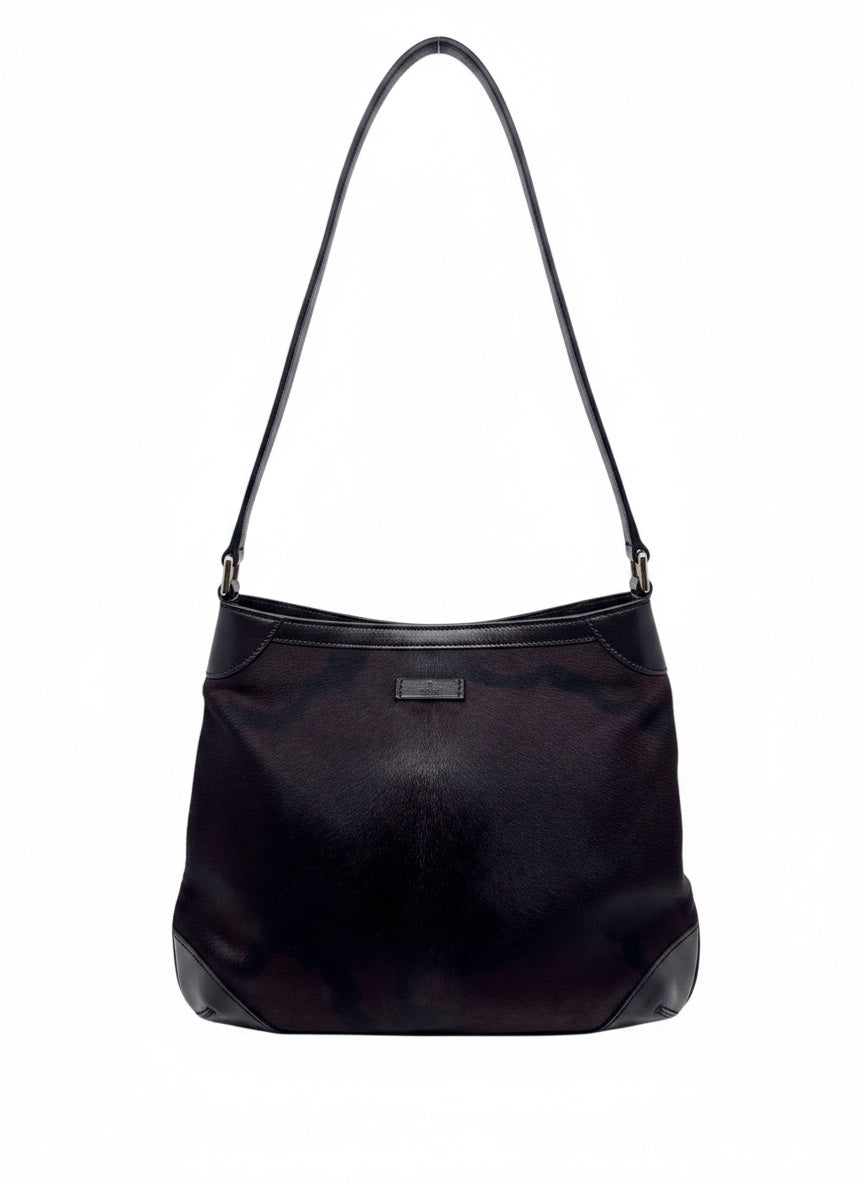 Posh Purse Co Gucci black pony hair shoulder bag with leather trim and elegant silhouette on a white background.