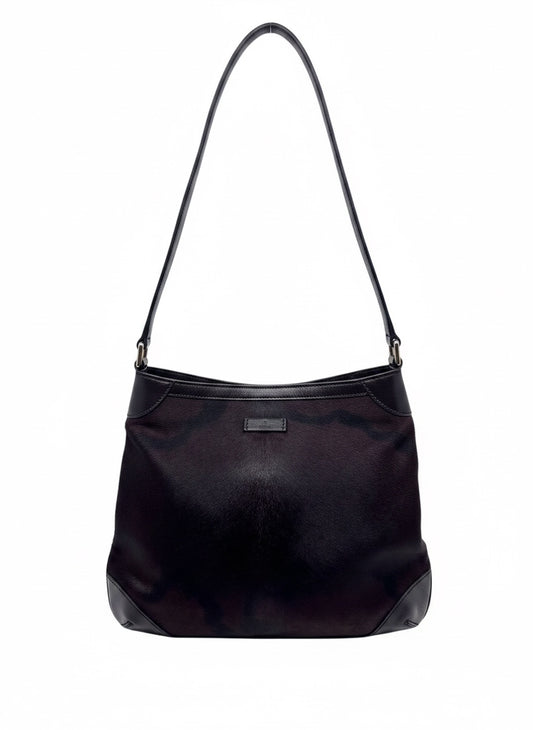 Posh Purse Co Gucci black pony hair shoulder bag with leather trim and elegant silhouette on a white background.