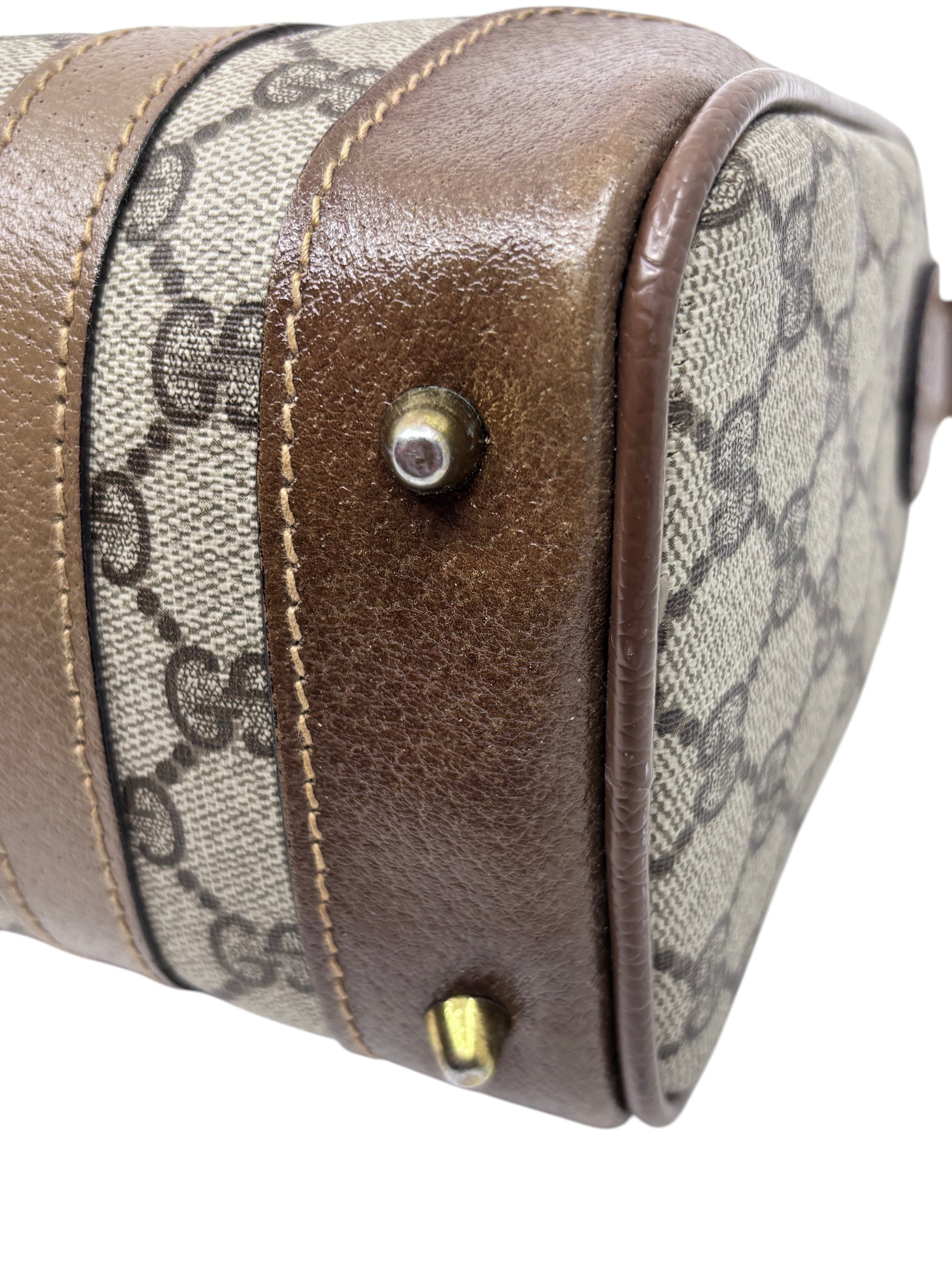 Posh Purse Co vintage Gucci Boston bag featuring brown leather trim and iconic monogram canvas with metal feet