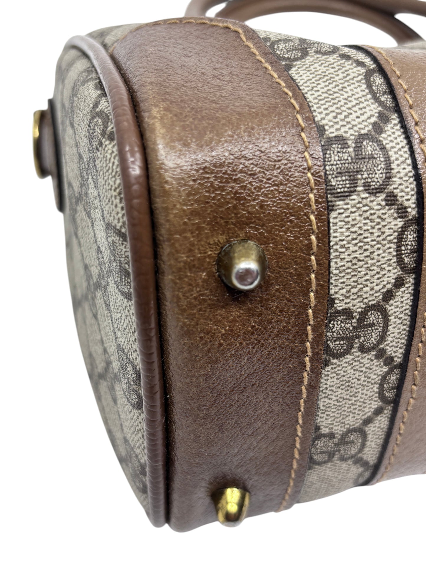 Posh Purse Co vintage Gucci Boston bag featuring iconic monogram canvas with brown leather trim and gold metal feet
